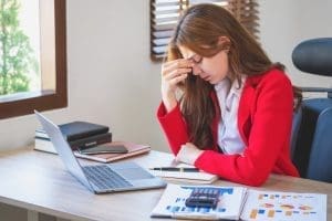 Business Woman frustrated by Online Marketing tools